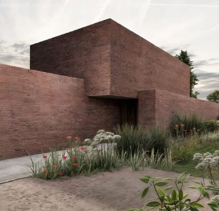 Edificio de ladrillo minimalista rodeado de vegetación, ejemplo de arquitectura fracasada según un grupo de Facebook.