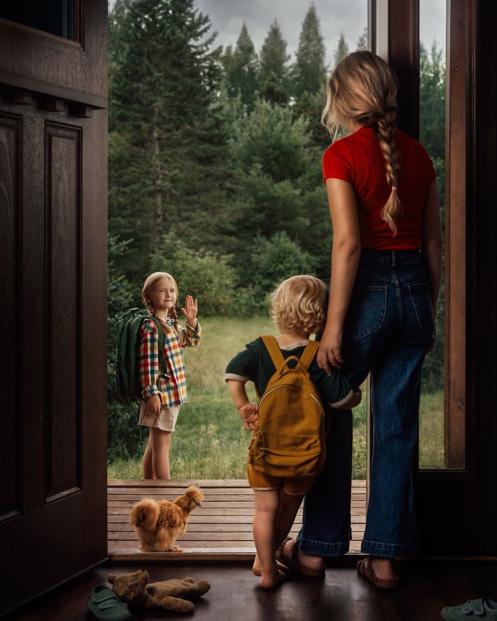 Mother watches as her two children with backpacks head outside, capturing the magic of childhood adventures.
