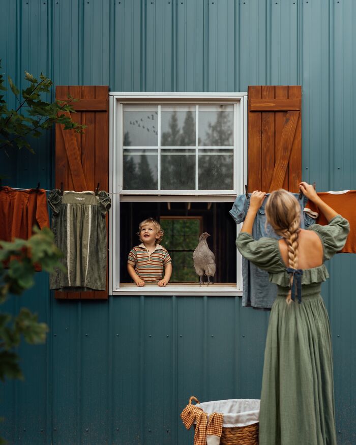 Mother and child sharing a moment at the window, with rustic charm and a glimpse of childhood magic.