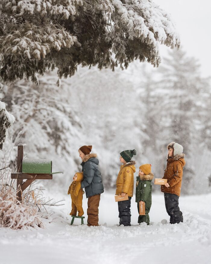 Children in winter coats mailing letters in a snowy forest, capturing the magic of childhood.