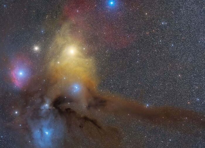 Astrophotography capturing a vibrant night sky with colorful nebulae and bright stars.