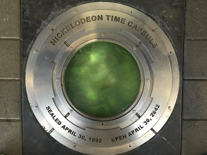 Nickelodeon time capsule sealed in 1992 to be opened in 2042, symbolizing 90s nostalgia and simpler, stranger days.