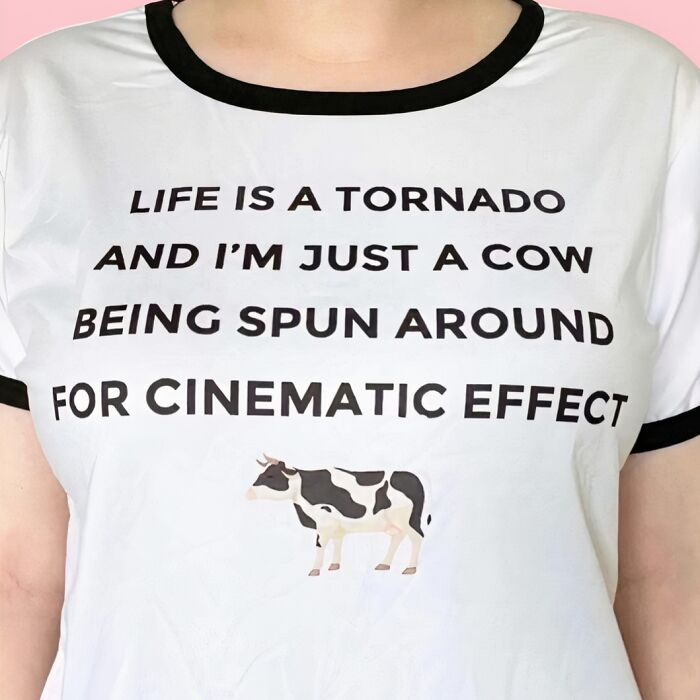 Chaotic T-shirt with funny text about a cow and tornado, featuring a cow illustration.