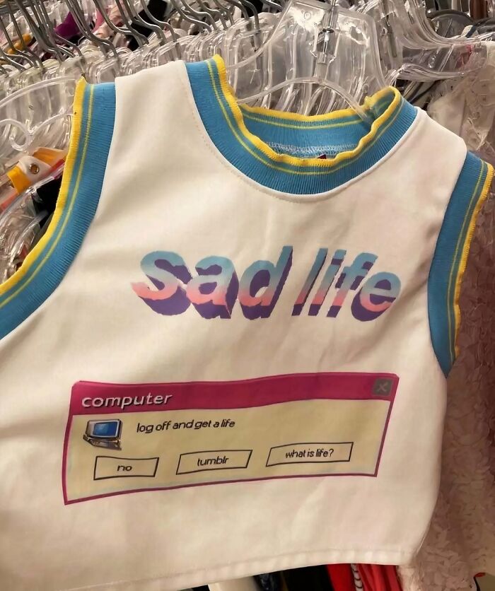 Chaotic T-shirt with "Sad life" and humorous computer error message design on display.
