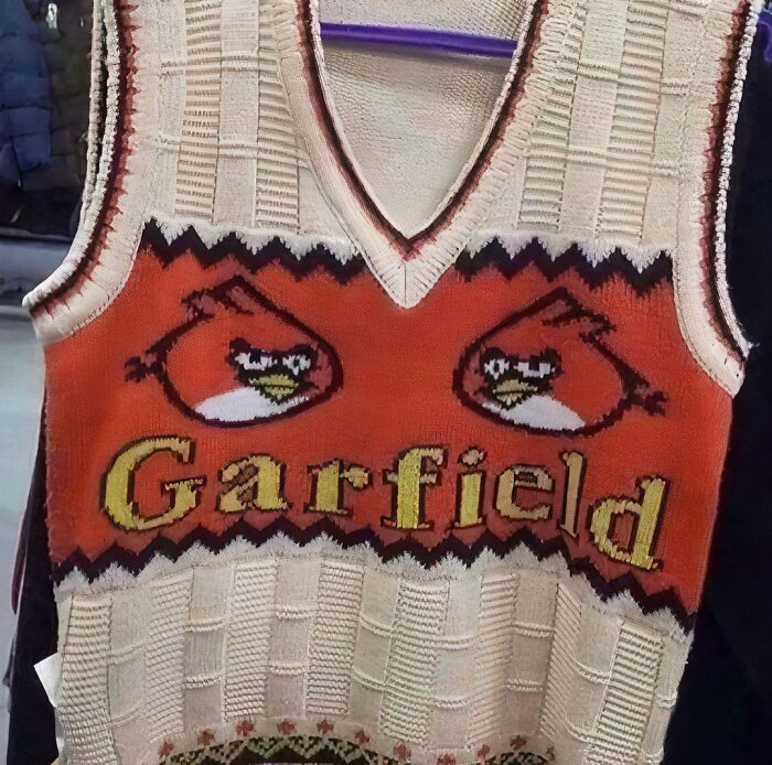 Chaotic T-shirt featuring a mix of cartoon characters, with "Garfield" text and bird graphics in vibrant colors.