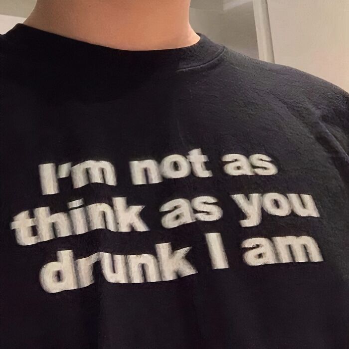 Black t-shirt with funny chaotic text: "I'm not as think as you drunk I am."