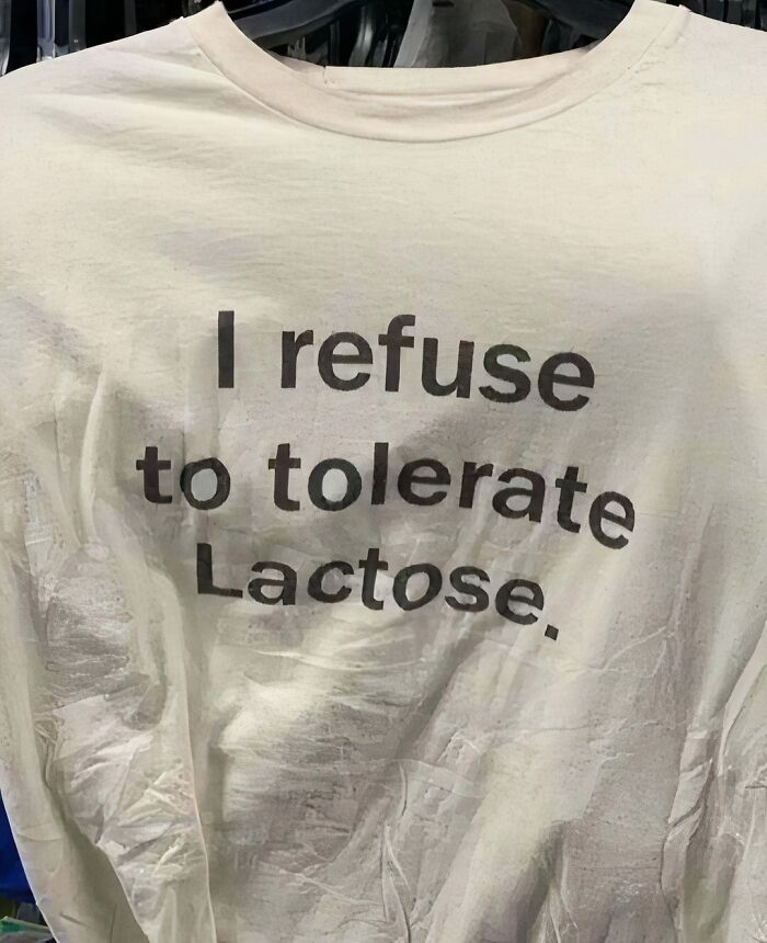 T-shirt with text "I refuse to tolerate lactose," showcasing chaotic humor.