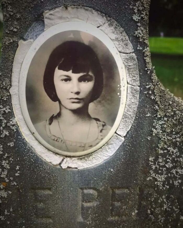 Vintage headstone portrait of a young woman with a bob haircut.