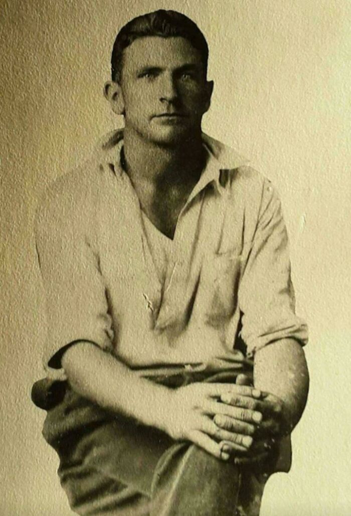 Man sitting, captured in a rare photo from 50-100 years ago, illustrating how much the world has changed.
