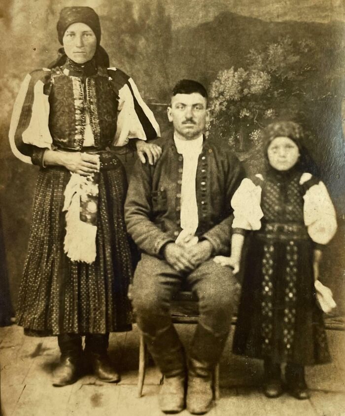 Vintage family portrait showcasing traditional attire, illustrating how much the world has changed over time.