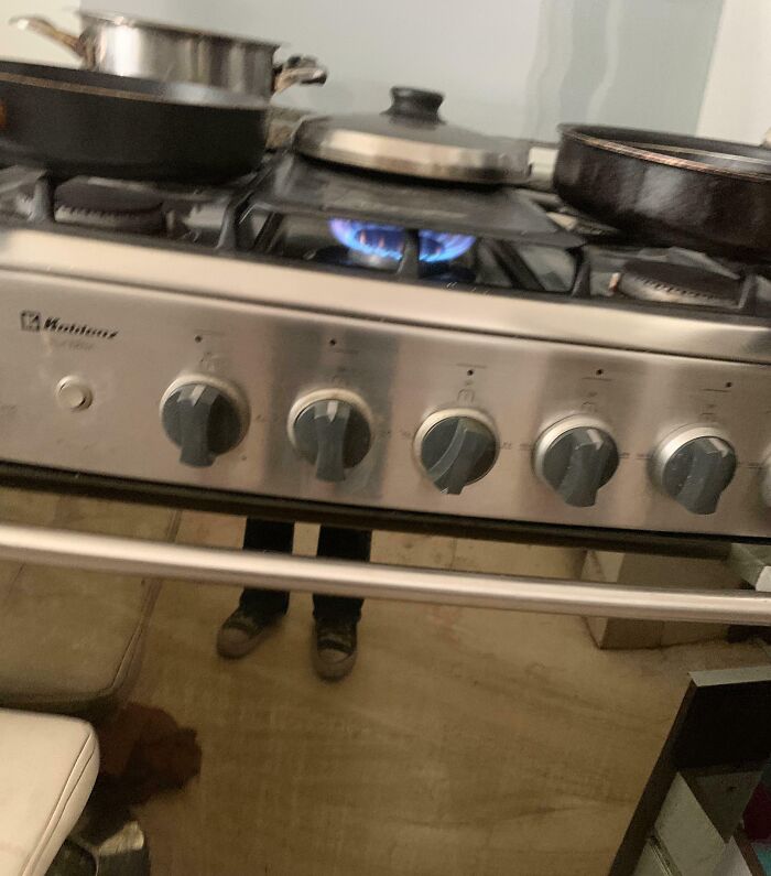 Gas stove left on with no pan, potential for expensive accident in kitchen.