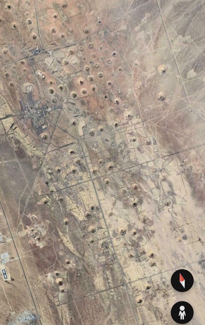 Strange circular patterns found on Google Earth in a desert landscape.