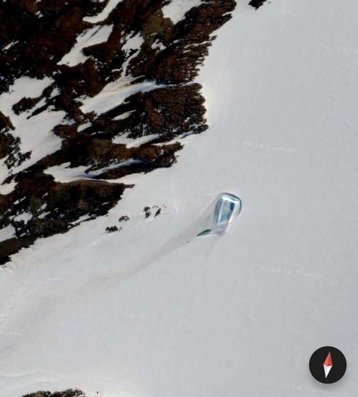 Strange object found on Google Earth, located in a snowy, rocky landscape.