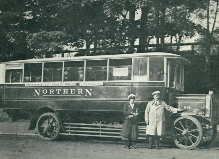 Vintage transport image showing two people standing next to an old Northern bus, illustrating how much the world has changed.