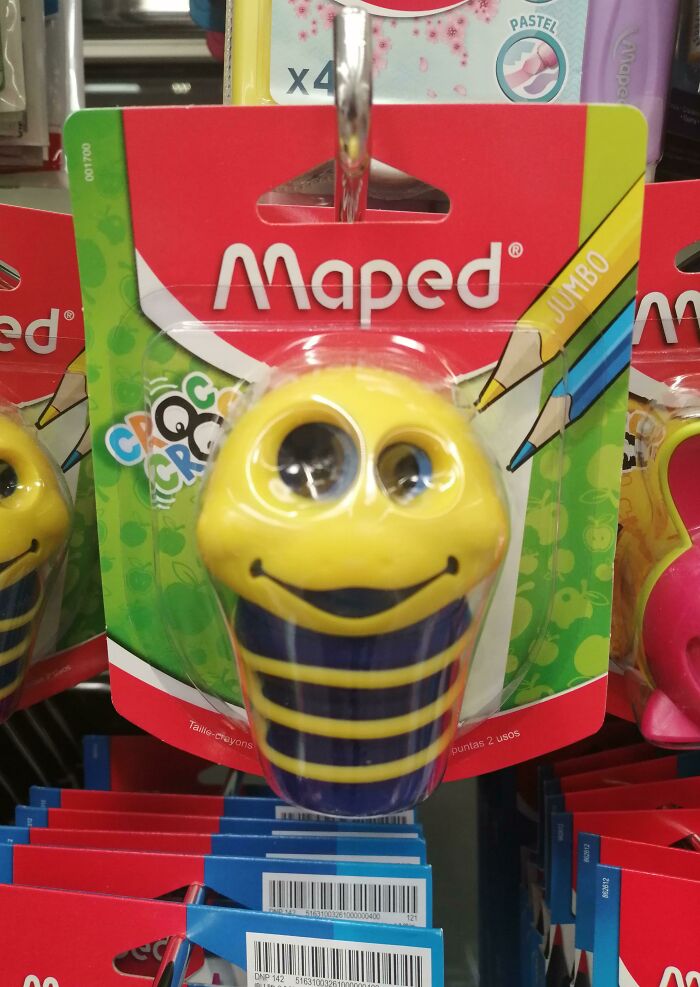 Yellow bee-themed pencil sharpener with a misaligned face, highlighting a humorous design fail.