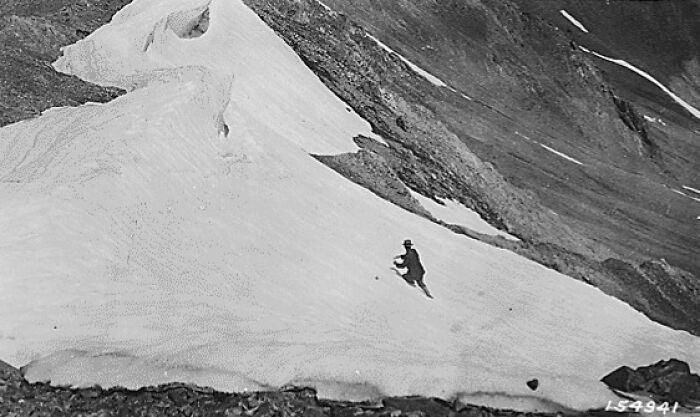 A person skiing on a snowy mountain slope, showcasing rare moments from the past and historical changes in the world.
