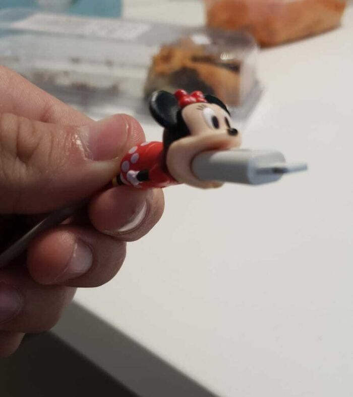 Minnie Mouse USB plug showcasing a design fail in hand.