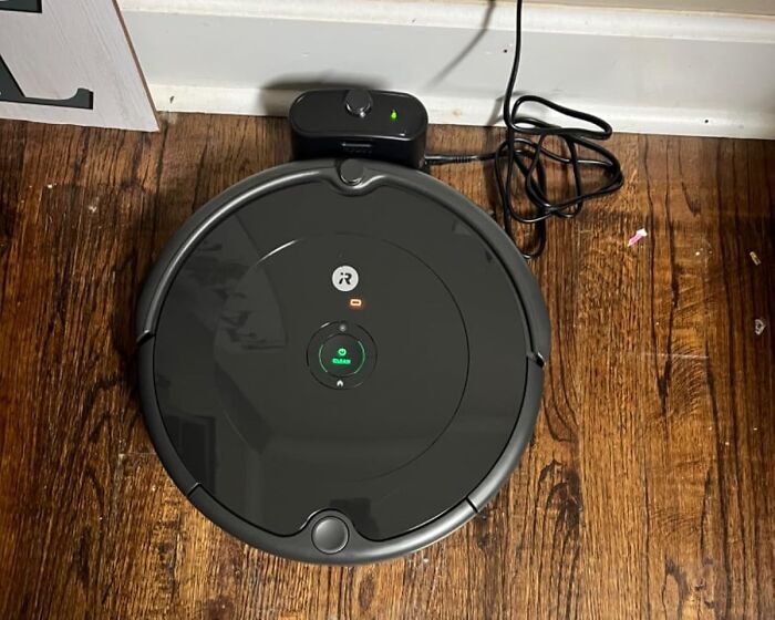 Robot vacuum cleaner on a wooden floor, part of Amazon spring deals.