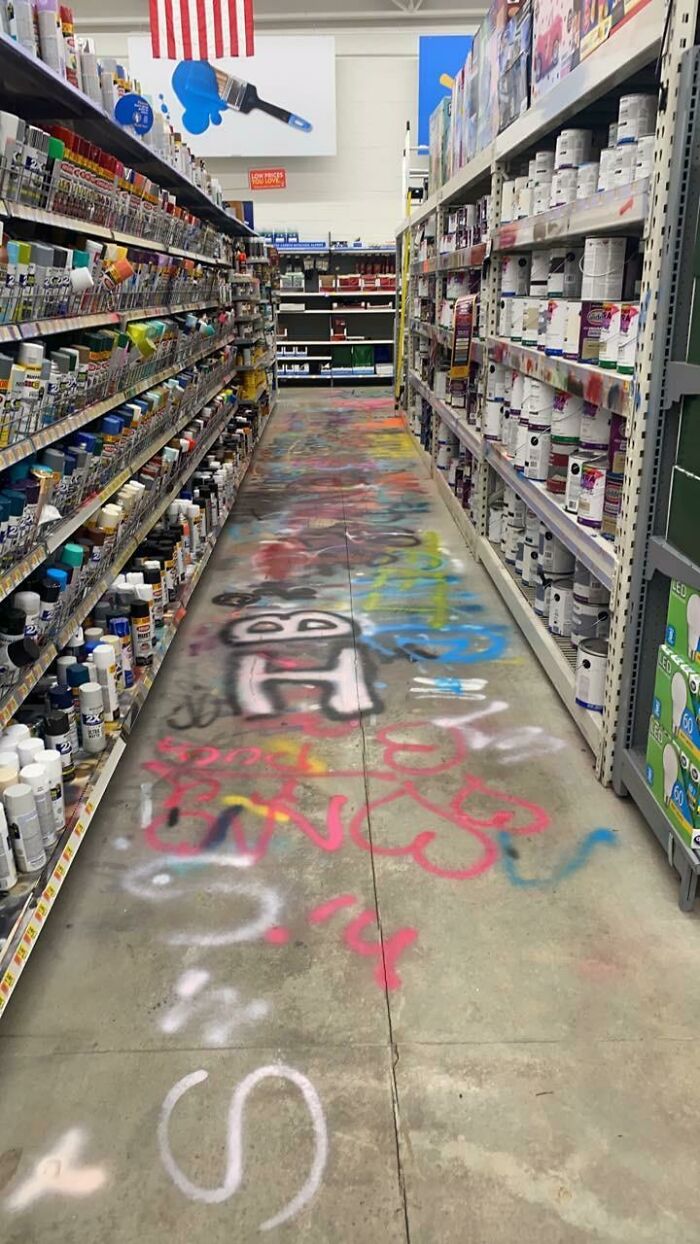 Spray paint chaos on store aisle floor illustrates customer cluelessness at hardware store.