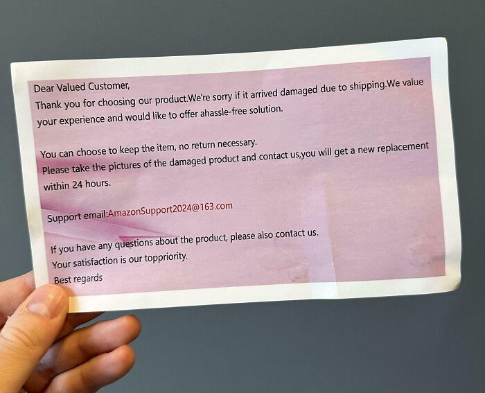 Person holding a scam letter offering replacements without returns, showcasing a shameless scam tactic.