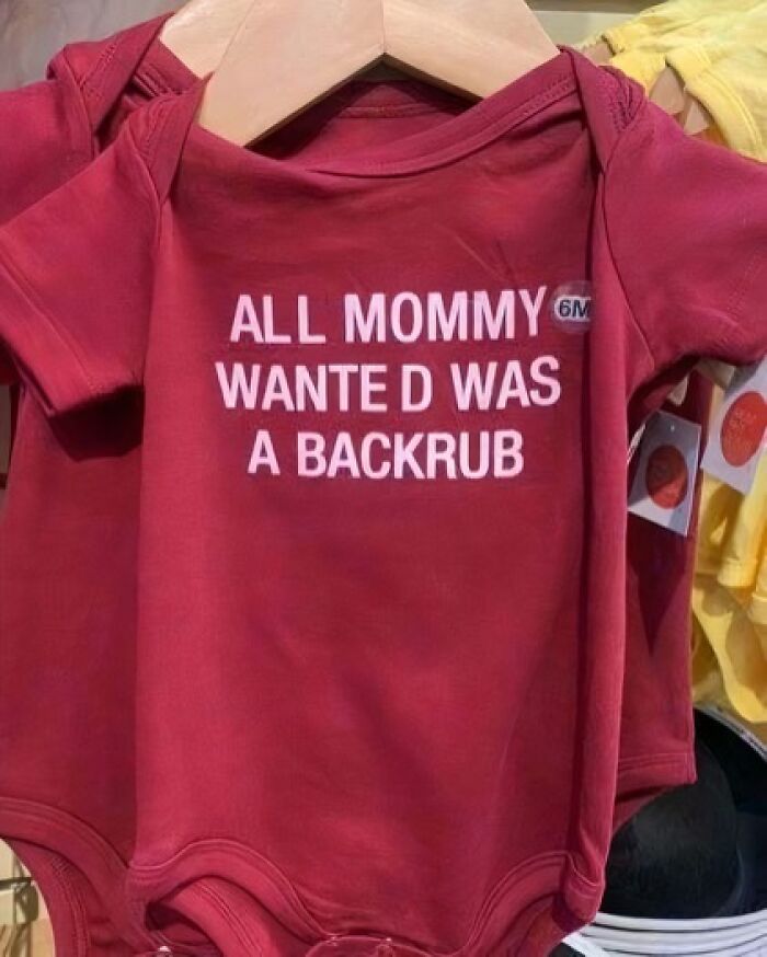 Red baby onesie with text humorously stating, "All Mommy wanted was a backrub," showcasing chaotic t-shirt design.