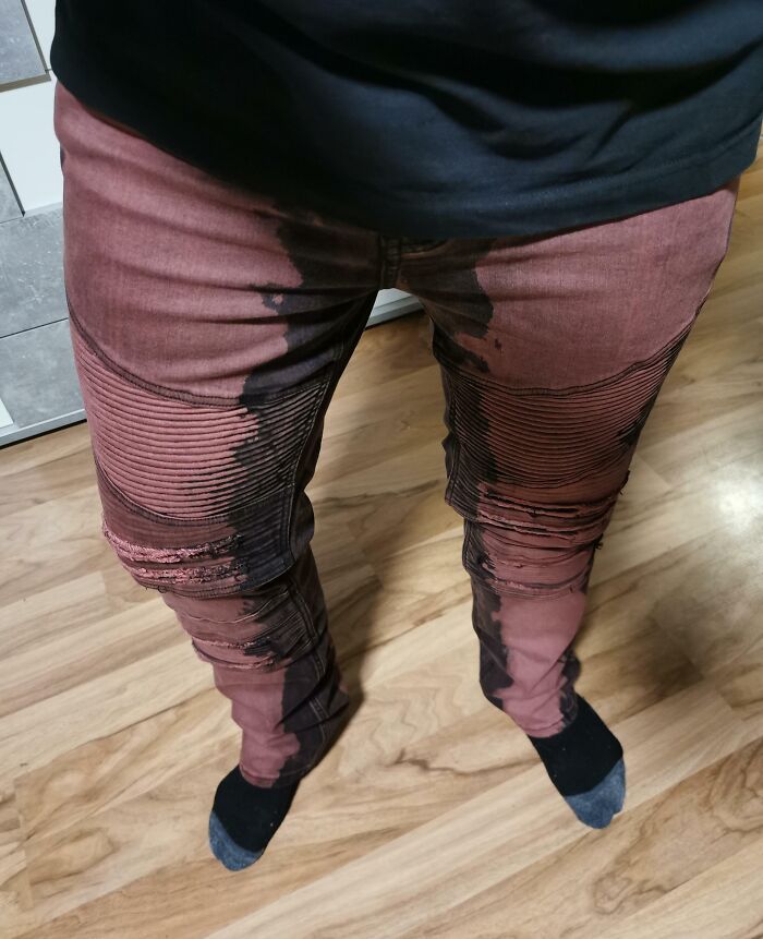 Design fail with poorly dyed pants creating an unintentional, uneven pattern on legs.