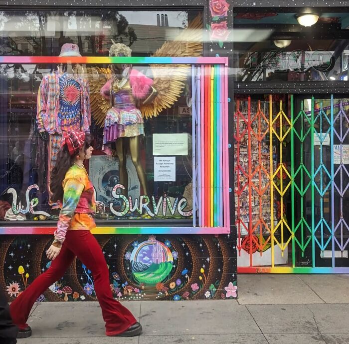 Colorful street scene in San Francisco, featuring a vibrant storefront and a woman in 70s-style clothing.