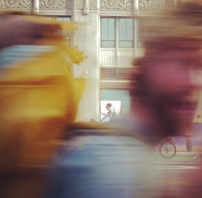 Blurred street scene capturing the essence of San Francisco through motion and urban life.