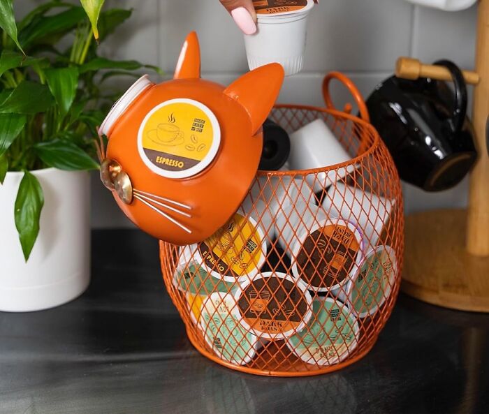 Cat-shaped espresso pod holder filled with random Amazon finds on a kitchen counter.