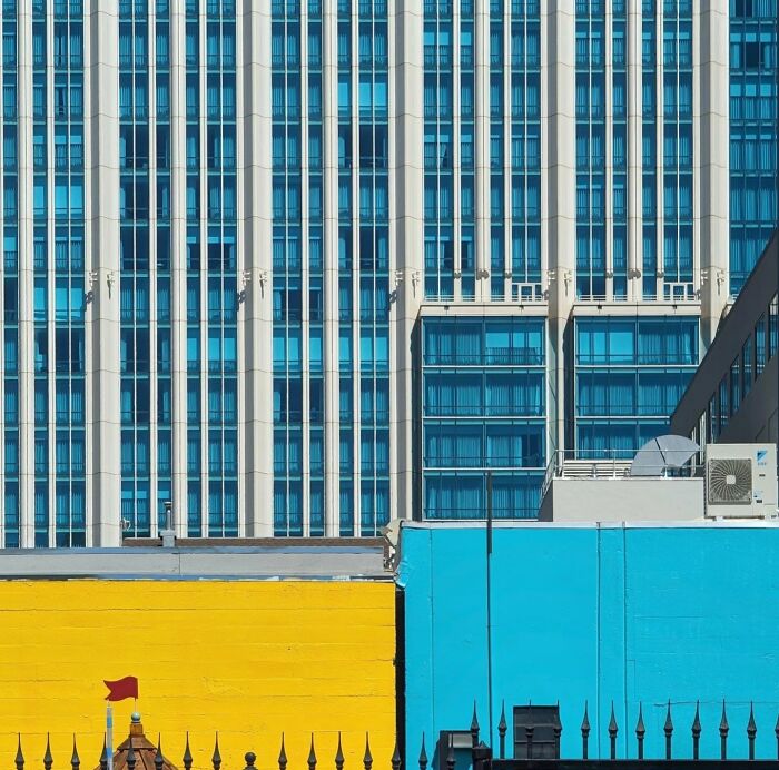 Colorful urban architecture in San Francisco, featuring vibrant yellow and blue building facades against a modern city backdrop.