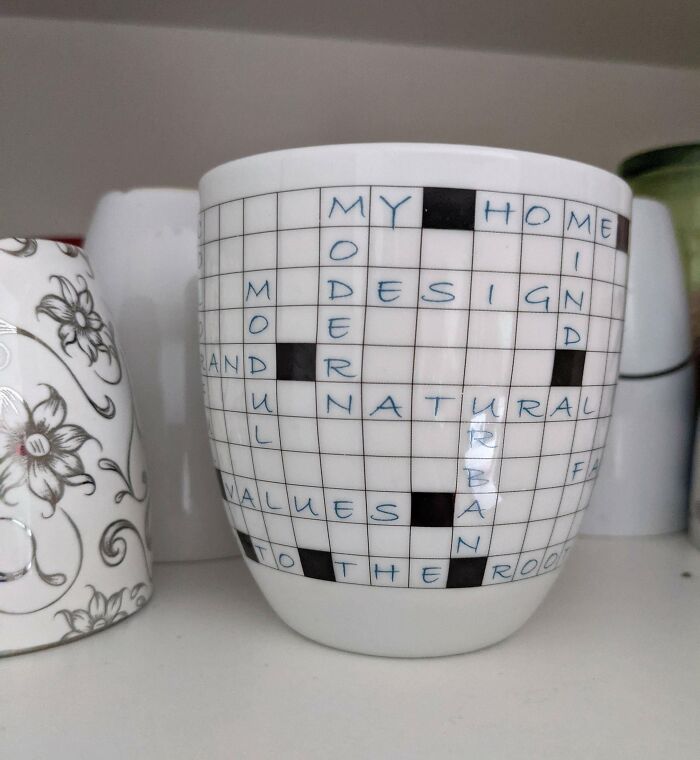 Crossword mug design fail with misplaced words in a kitchen setting.