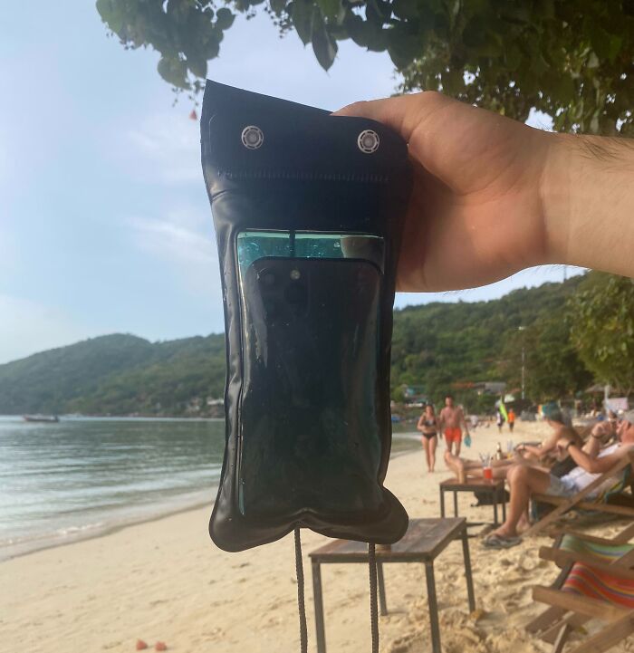 Expensive accident as a phone inside a wet pouch by the beach.