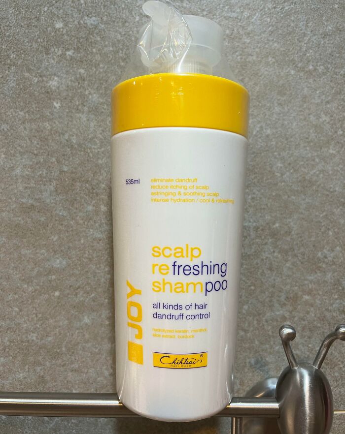 Shampoo bottle with incorrect label spelling, showcasing a design fail.