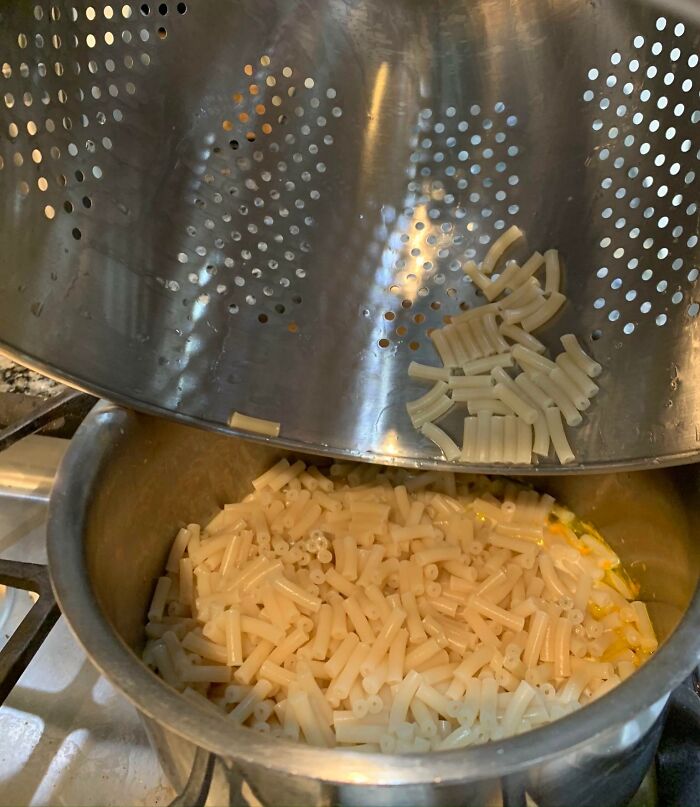 Pasta design fail: colander holes too large, causing pasta loss.