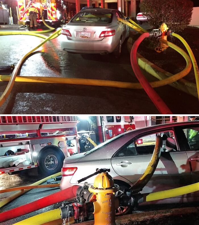 Car surrounded by fire hoses after an expensive accident near a hydrant.