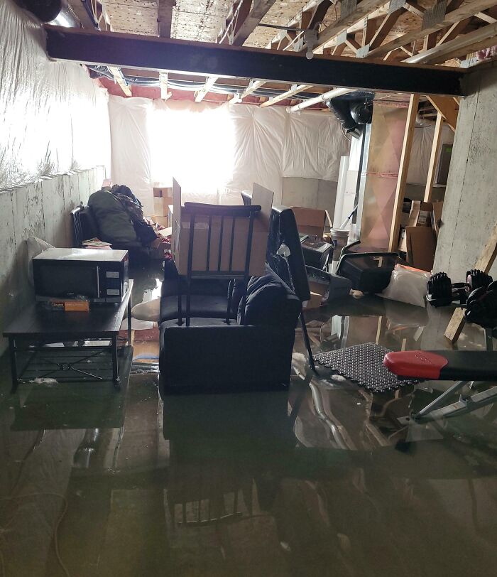 "Basement filled with water after super expensive accident causes flooding and damage."
