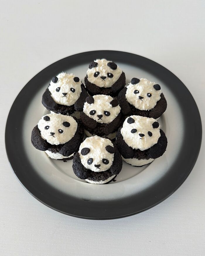 Adorable food arrangement with panda cupcakes by Korean artist on a black and white plate.