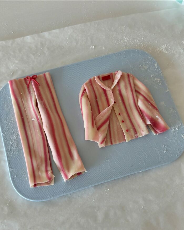 Adorable food art by Korean artist: striped pants and jacket crafted from edible materials on a cutting board.