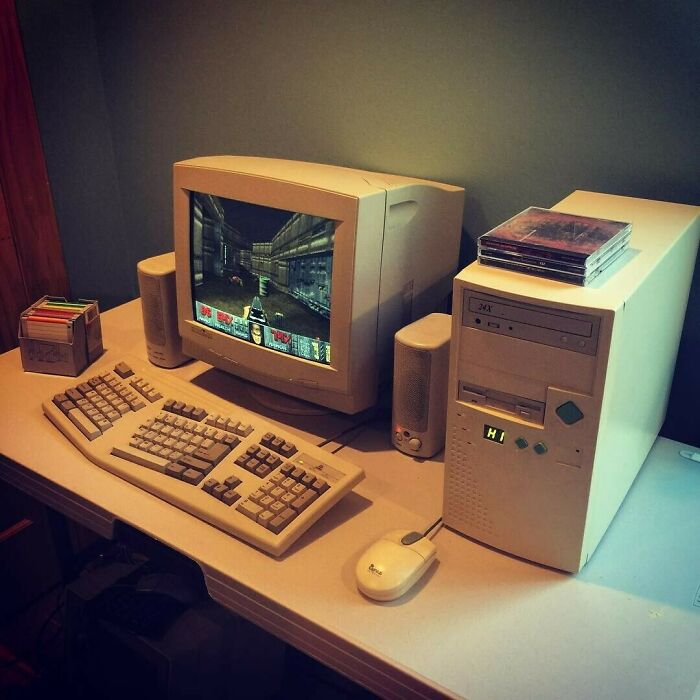 Retro 1980s computer setup with CRT monitor and floppy disks, capturing the era's tech vibe.