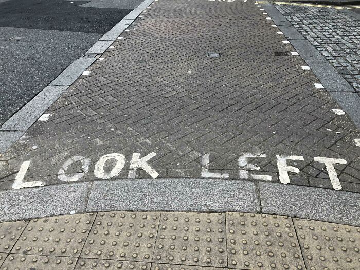 Crosswalk with "Look Left" guidance, part of how countries care for their citizens' safety.