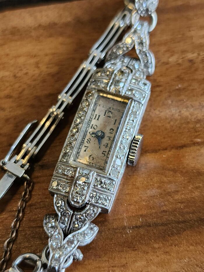 Ornate vintage watch with intricate detailing found in an old house.