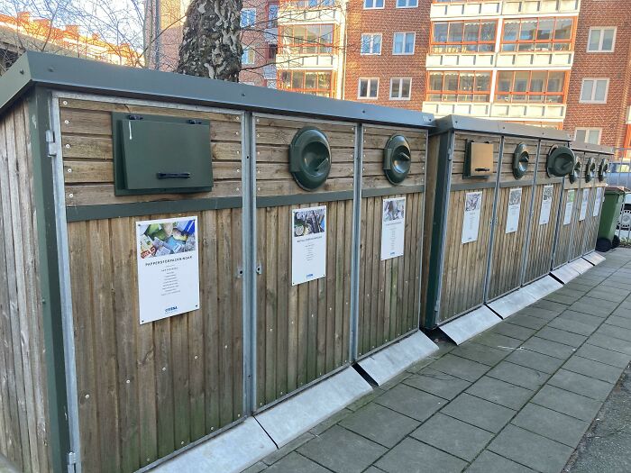 Recycling bins in a modern setup showcasing innovative ways countries support their citizens.