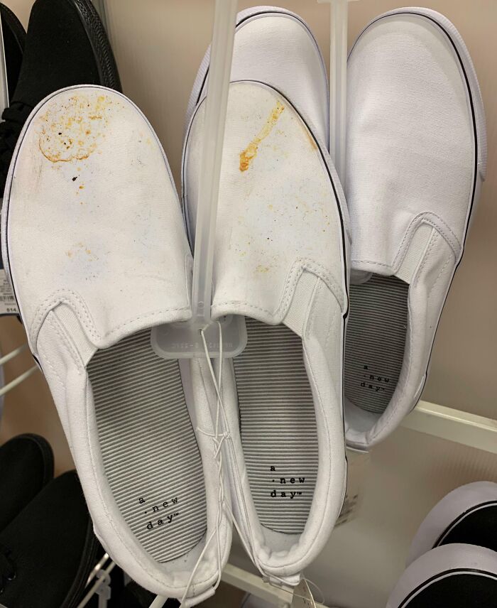 White slip-on shoes with visible stains, exemplifying customer cluelessness in retail settings.