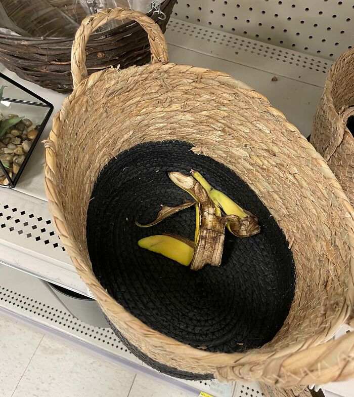 Banana peel in a store basket, highlighting customer cluelessness at a retail display.