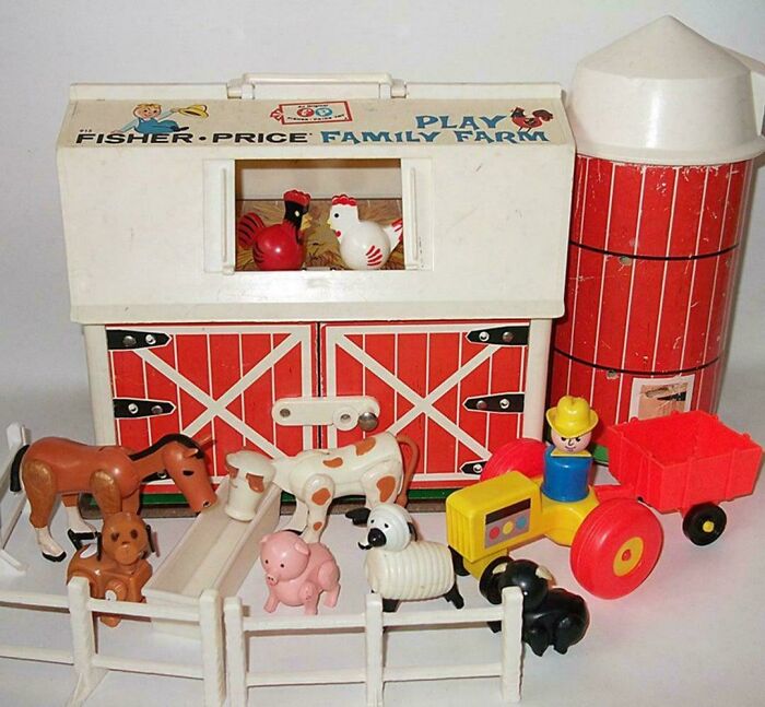 Vintage 1980s Fisher-Price family farm toy set with barn, animals, and tractor, encapsulating 1980s nostalgia.