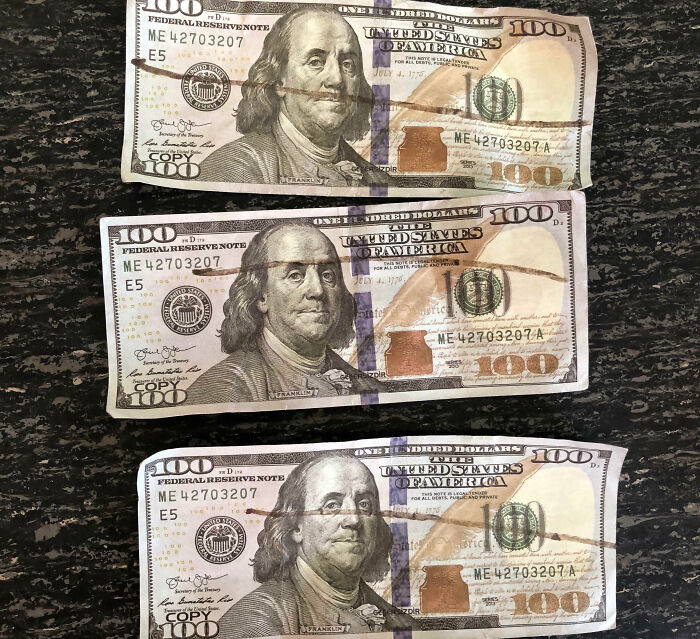 Three counterfeit $100 bills labeled 'copy,' illustrating customer cluelessness.