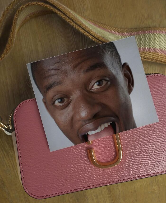 Illusion art by Dudi Ben Simon featuring a photo overlay on a pink bag creating a face fusion effect.