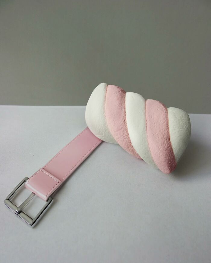 Pink strap with a twisted marshmallow, an illusionary fusion showcasing art of illusion.