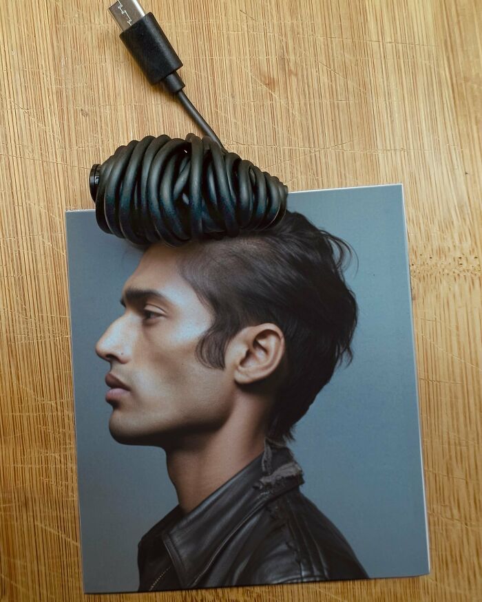 Coiled cable resembling hair on a profile photo, showcasing the art of illusion and creative fusions.