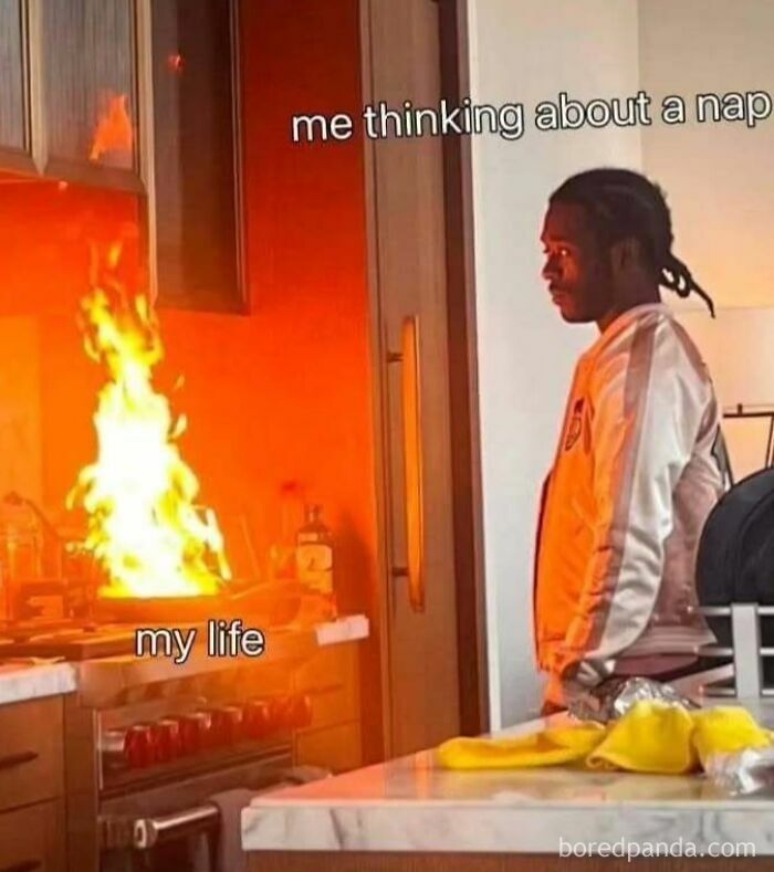 Introvert meme showing a person staring at a kitchen fire, labeled "me thinking about a nap" and "my life."
